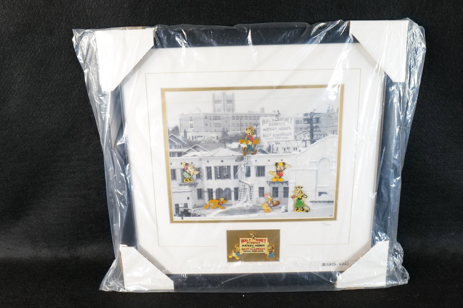 Disney Limited Edition Framed Silly Symphony Pin Set: Disney Limited Edition Framed Silly Symphony Pin Set. Entitled Studio Days. Features pins including Mickey, Minnie , Donald Duck, Goofy, Pluto, Daisy Duck, Clarabelle, and Horace. Displayed on a print