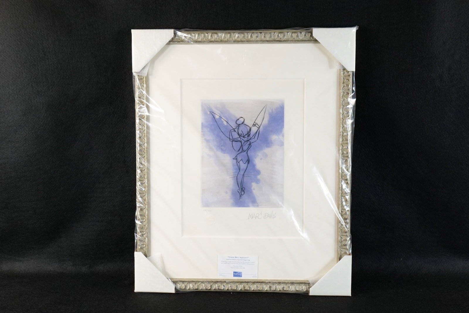 Framed Tinker Bell Limited Edition Aqua Tint Engraving: Framed Tinker Bell Limited Edition Aqua Tint Engraving. Done by artist Marc Davis. Limited Edition #270 out of 600. Numbered and signed by the artist. New condition. Comes with COA and original price 