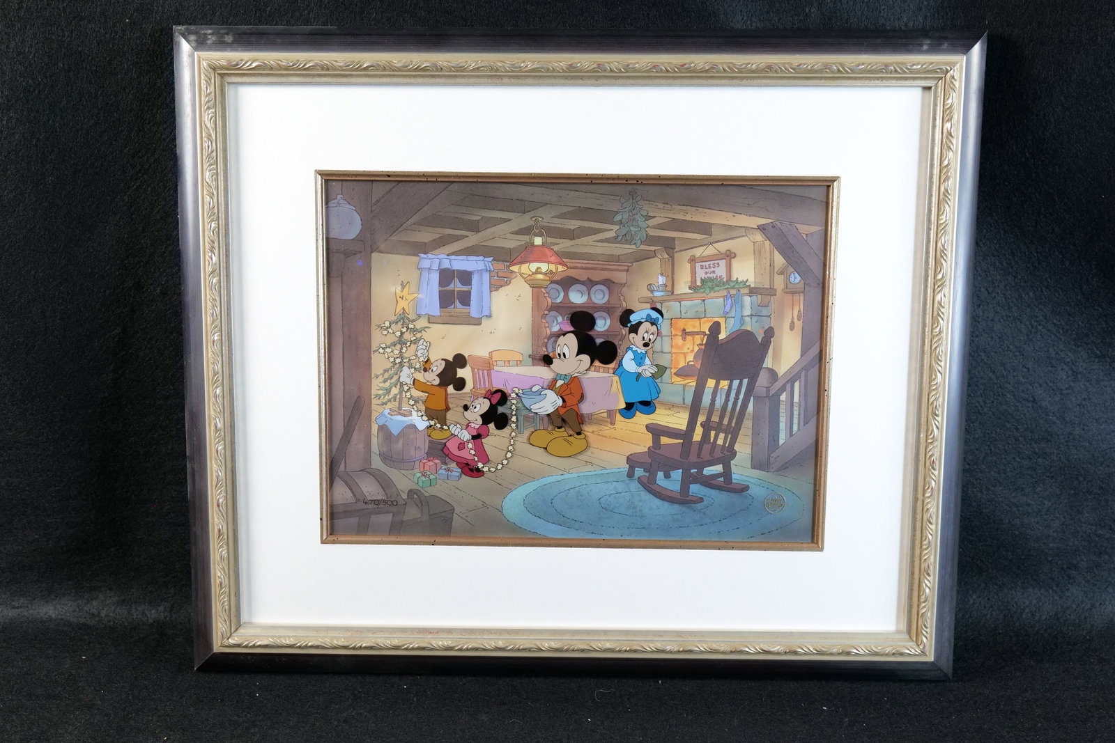 Mickey's Christmas Carol Hand Painted Character Cel: Mickey's Christmas Carol Limited Edition Hand Painted Character Cel. Depicting the Cratchit family in the kitchen. #470 of 500. Comes with the Walt Disney Gold logo on the bottom right corner. Framed 