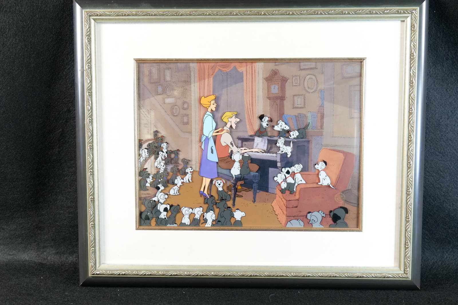 Disney 101 Dalmatians Limited Edition Hand Painted Character Cel: Disney 101 Dalmatians Limited Edition Hand Painted Character Cel. "At the Piano". #310 of 500. Framed and matted. Comes with COA. Shame has some scuffing on the left side. Measures 20 1/2 inches tall 