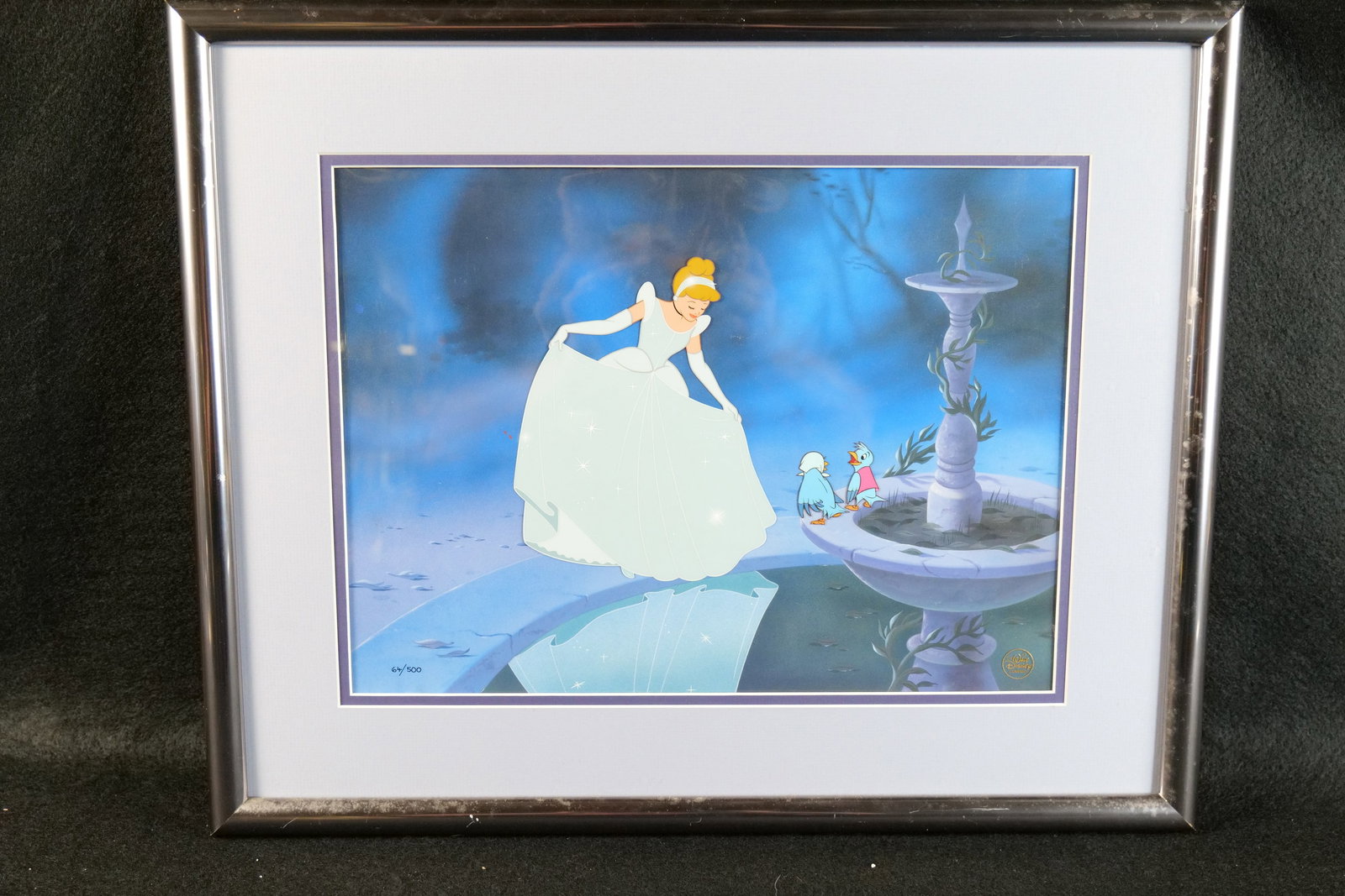 Cinderella Hand Painted Limited Edition Character Cel: Cinderella Hand Painted Limited Edition Character Cel. Cinderella looking at her reflection in the Fountain. Limited Edition #64 of 500. Comes with COA. Has the gold Disney seal on the bottom right. M