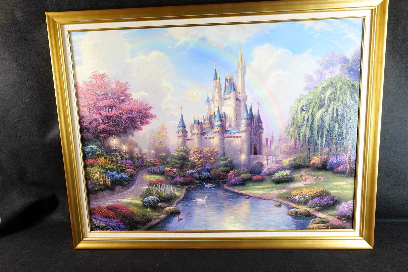 Thomas Kinkade "A New Day at Cinderella Castle" Limited Edition Print on Canvas: Thomas Kinkade "A New Day at Cinderella Castle" Limited Edition Print on Canvas. Depicting a colorful scene with Tinkerbell flying by Cinderella Castle and Rainbows in the Sky. Comes with COA. Renaiss