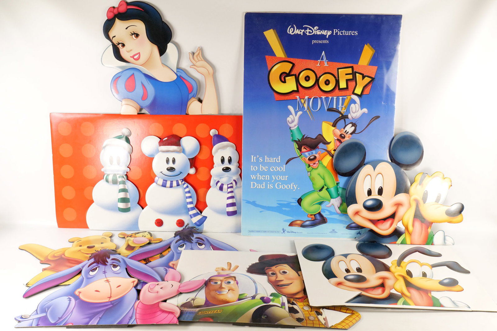 Lot of Disney Store Cardboard Cutouts: Lot of Disney Store Cardboard Cutouts. Including Snow White, Woody and Buzz, Eeyore and Piglet, Holiday Mickey Goofy and Donald, and more. Many pieces have some bends or missing body parts. Also inclu