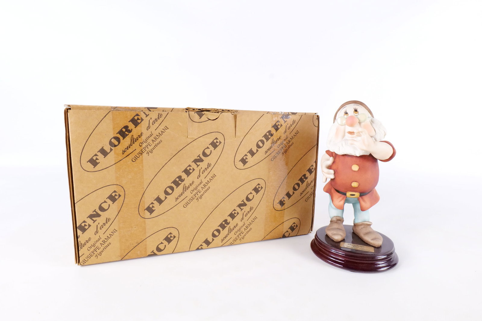 Disney Armani Doc Dwarf Figurine: Disney Giuseppe Armani Snow White Doc Dwarf Figurine - 326C . Measures 7 inches tall by 3.75 inches wide. Comes with original box and paperwork. All invoices must be paid within 24 hours of the sale. 