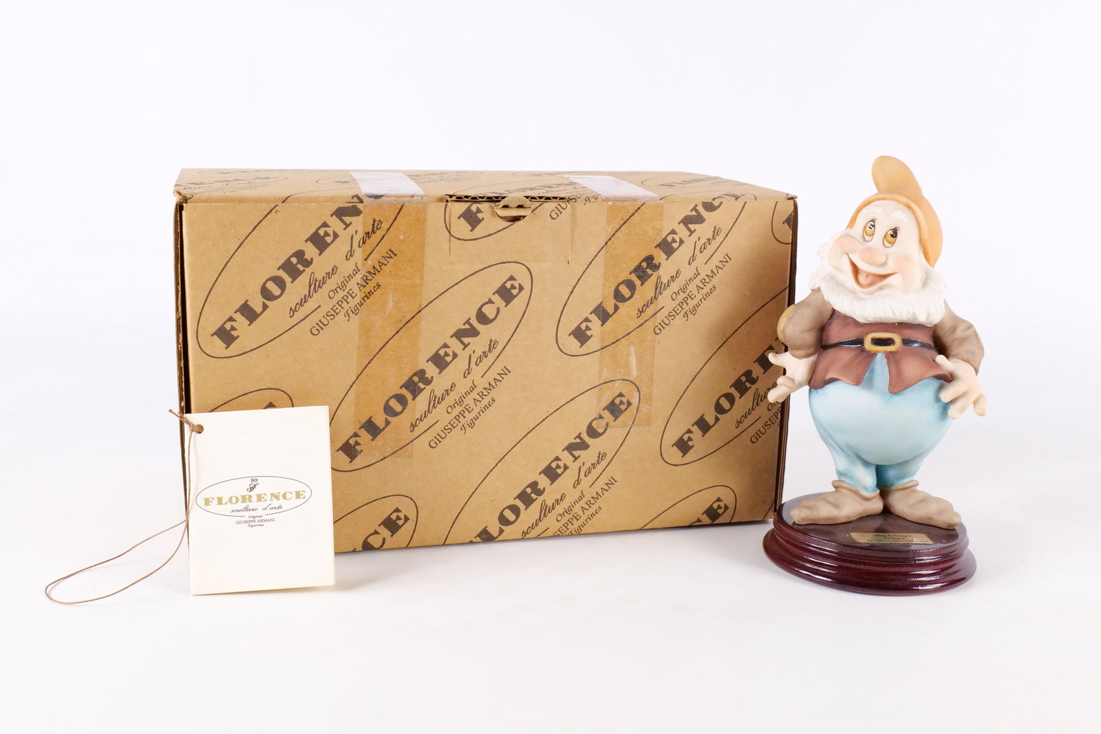 Disney Armani Happy Dwarf Figurine: Disney Giuseppe Armani Snow White Happy Dwarf Figurine - 327C . Measures 7 inches tall by 3.75 inches wide. Comes with original box and paperwork. All invoices must be paid within 24 hours of the sale