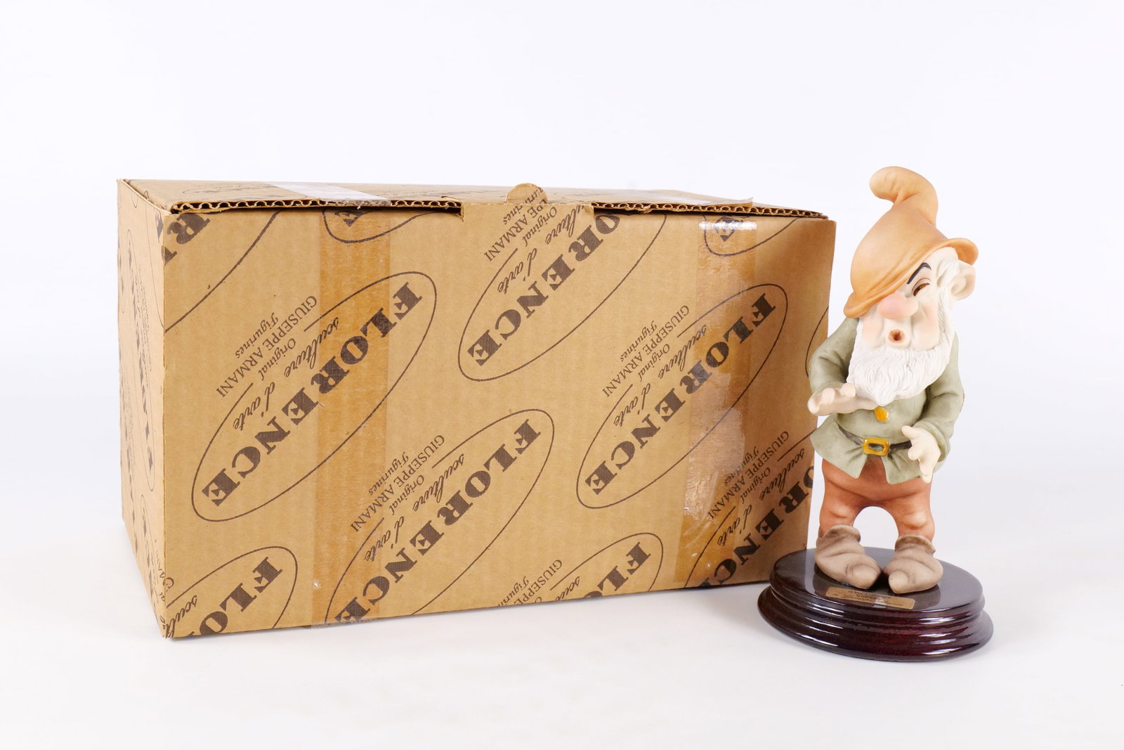Disney Armani Sneezy Dwarf Figurine: Disney Giuseppe Armani Snow White Sneezy Dwarf Figurine - 914C . Measures 7 inches tall by 3.75 inches wide. Comes with original box and paperwork. All invoices must be paid within 24 hours of the sal
