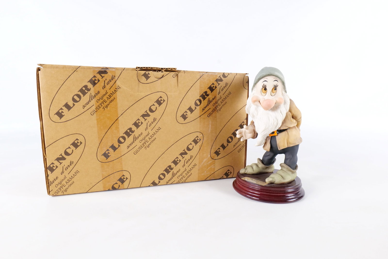 Disney Armani Bashful Dwarf Figurine: Disney Giuseppe Armani Snow White Bashful Dwarf Figurine - 916C . Measures 7 inches tall by 3.75 inches wide. Comes with original box and paperwork. All invoices must be paid within 24 hours of the sa