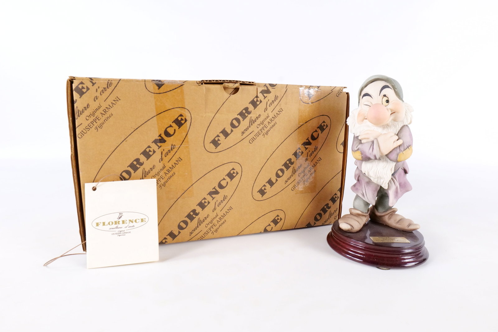 Disney Armani Grumpy Dwarf Figurine: Disney Giuseppe Armani Snow White Grumpy Dwarf Figurine - 917C . Measures 7 inches tall by 3.75 inches wide. Comes with original box and paperwork. All invoices must be paid within 24 hours of the sal