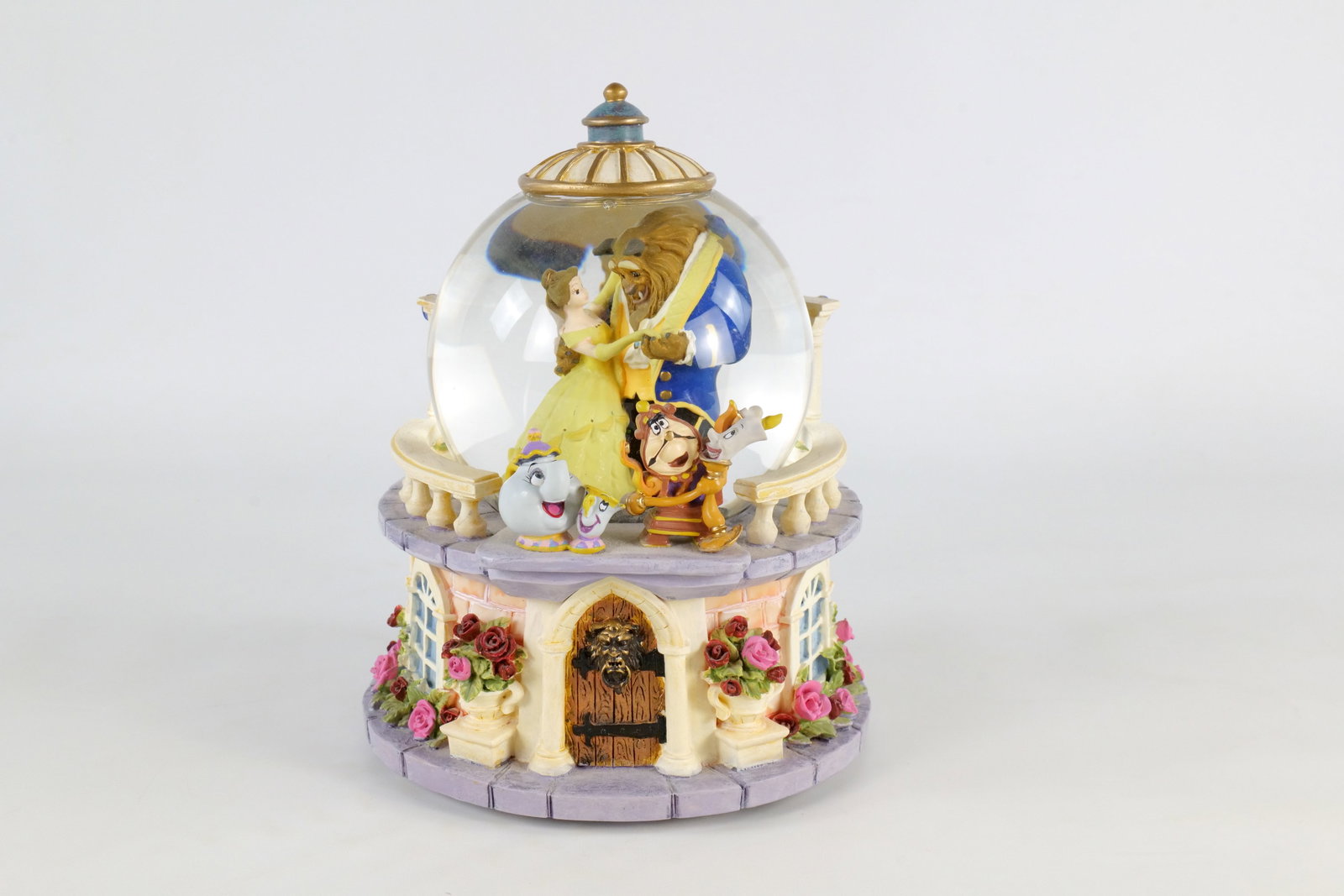 Disney Beauty and the Beast "Rose Garden" Musical Snow Globe: Disney Beauty and the Beast "Rose Garden" Musical Snow Globe. Features Cogsworth, Lumiere, Mrs. Potts and Chip, Belle and Beast. Music function is working. Good condition. Measures 8 1/2 inches tall. 