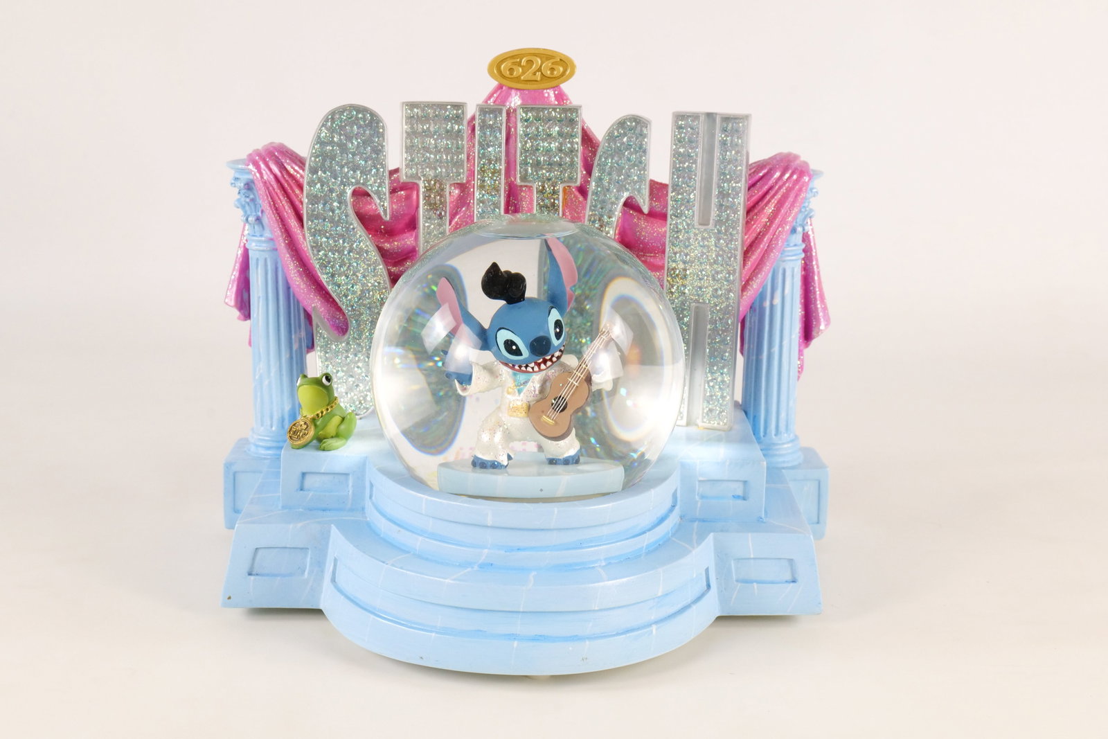 Disney Stitch as Elvis Musical Snow Globe: Disney Stitch as Elvis Musical Snow Globe. Musical component is working. Tested with batteries and the spinning and light up feature do not appear to be working. The battery chamber plastic cover also