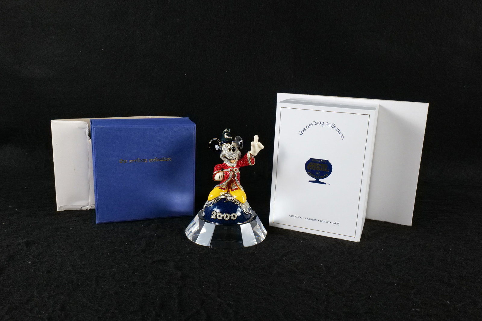 Disney Swarovski Arribas Bros Millennium Mickey Sorcerer Crystal Figurine: Disney Swarovski Arribas Bros Millennium Mickey Sorcerer Crystal Figurine with Base. Limited edition #109 of 2000. Comes with COA. Both come with boxes. Measures 4 1/2 inches tall by 2 1/2 inches