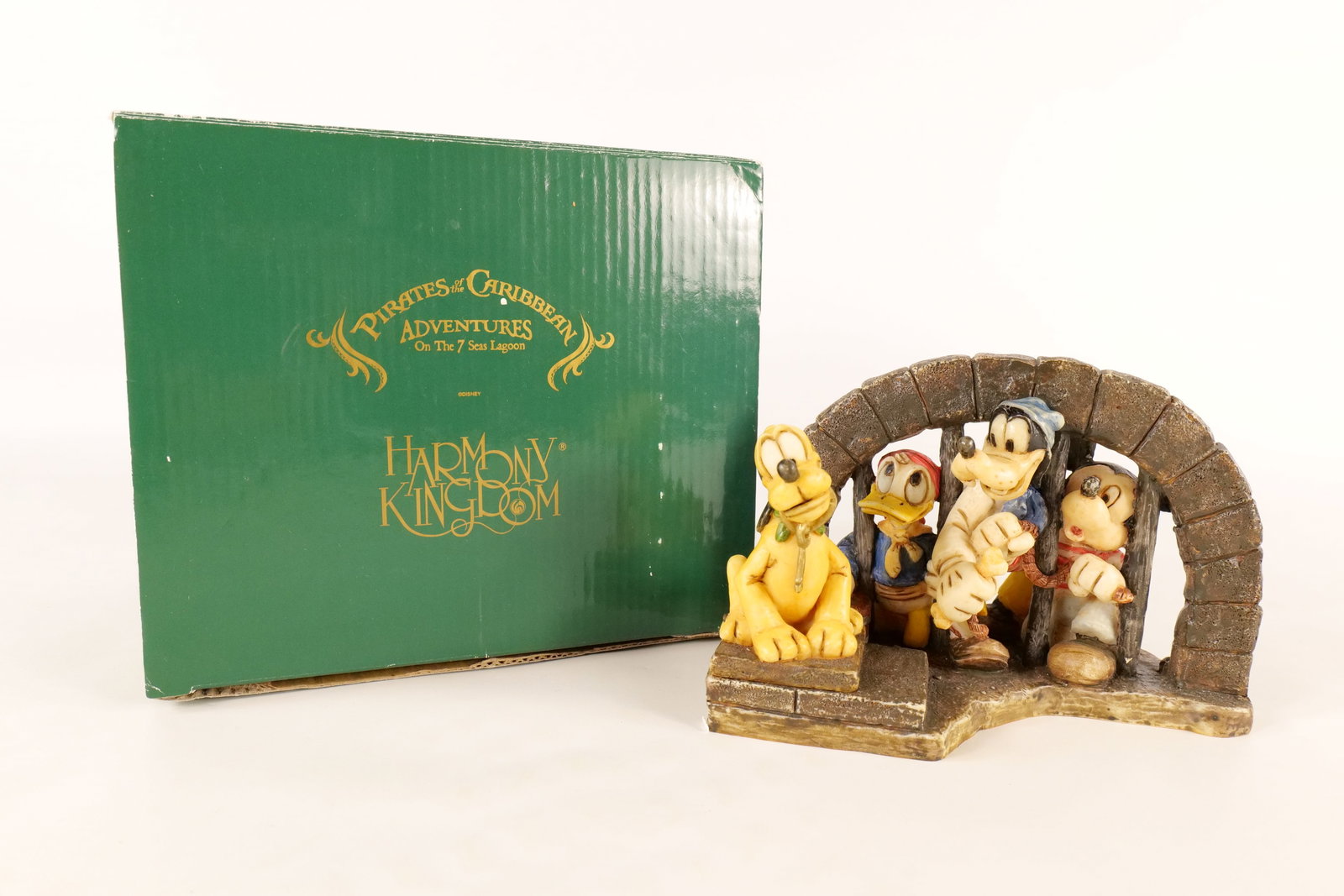 Walt Disney Harmony Kingdom "Pirates of the Caribbean" Figurine: Walt Disney Harmony Kingdom "Pirates of the Caribbean" Figurine. Comes from the Pirates of the Caribbean Adventures on the Seven Sea Lagoon. Limited edition to 500 pieces. Artists signed Robert King o