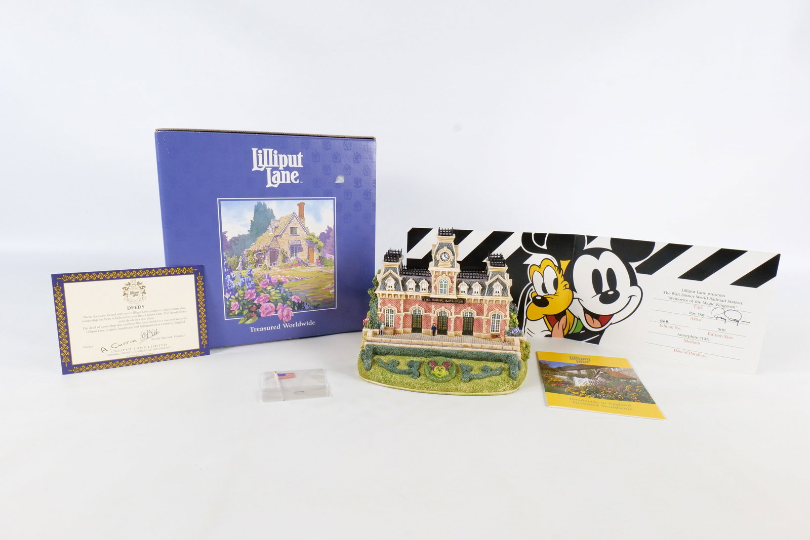 Lilliput Lane Walt Disney Railroad Station "Memories of the Magic Kingdom" Figurine: Lilliput Lane Walt Disney Railroad Station "Memories of the Magic Kingdom" Figurine. By artist Ray Day. Limited Edition #68 of 500 . Comes with COA an original box. COA is Artist signed. Measures 5