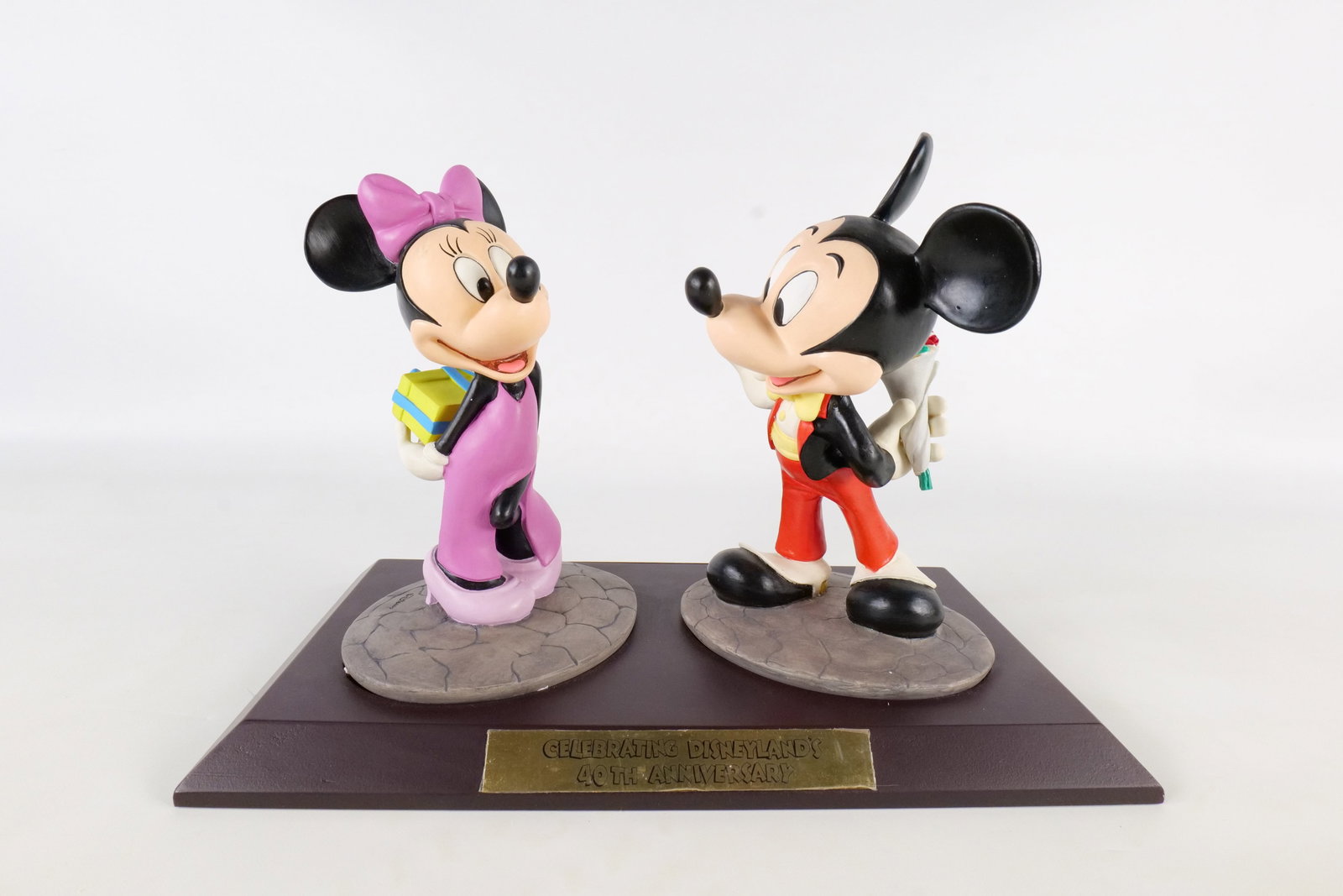 Celebrating Disneyland 40th Anniversary Mickey and Minnie Mouse Sculpture: Celebrating Disneyland 40th Anniversary Mickey and Minnie Mouse Sculpture. Limited edition to 1500 pieces. Signed by artist Marc Delle on the back. Measures 9 1/2 inches tall by 12.75 inches wide.