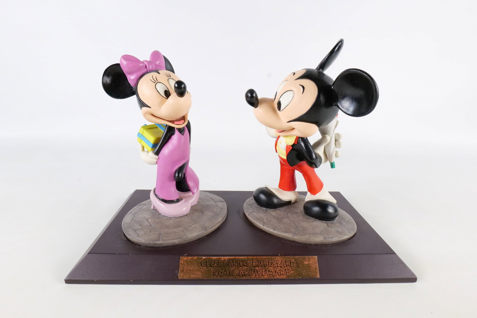 Celebrating Disneyland 40th Anniversary Mickey and Minnie Mouse Sculpture: Celebrating Disneyland 40th Anniversary Mickey and Minnie Mouse Sculpture. Limited edition to 1500 pieces. Signed by artist Marc Delle on the back. Measures 9 1/2 inches tall by 12.75 inches wide.