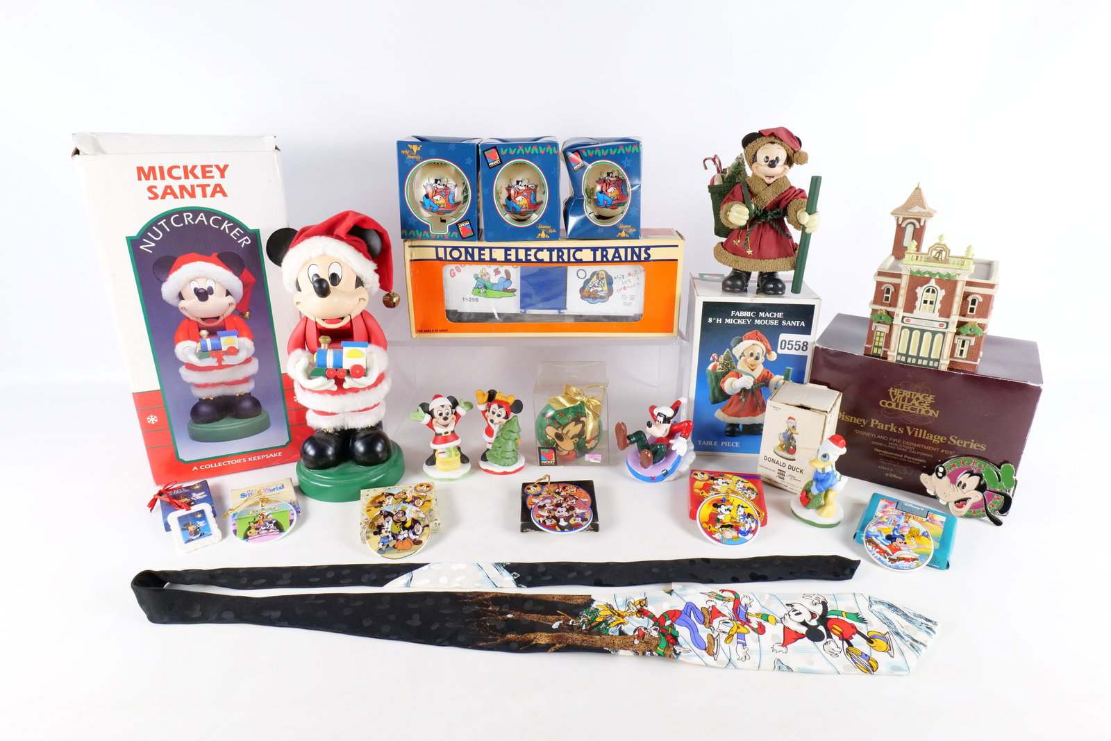 Lot of Disney Christmas Items: Lot of Disney Christmas Items. Including Department 56 Disneyland Fire Department, Fabric Mache Mickey Santa, Kurt Adler Mickey Santa Nutcracker, Lionel Train Goofy Boxcar, Various Disney Ornaments, V