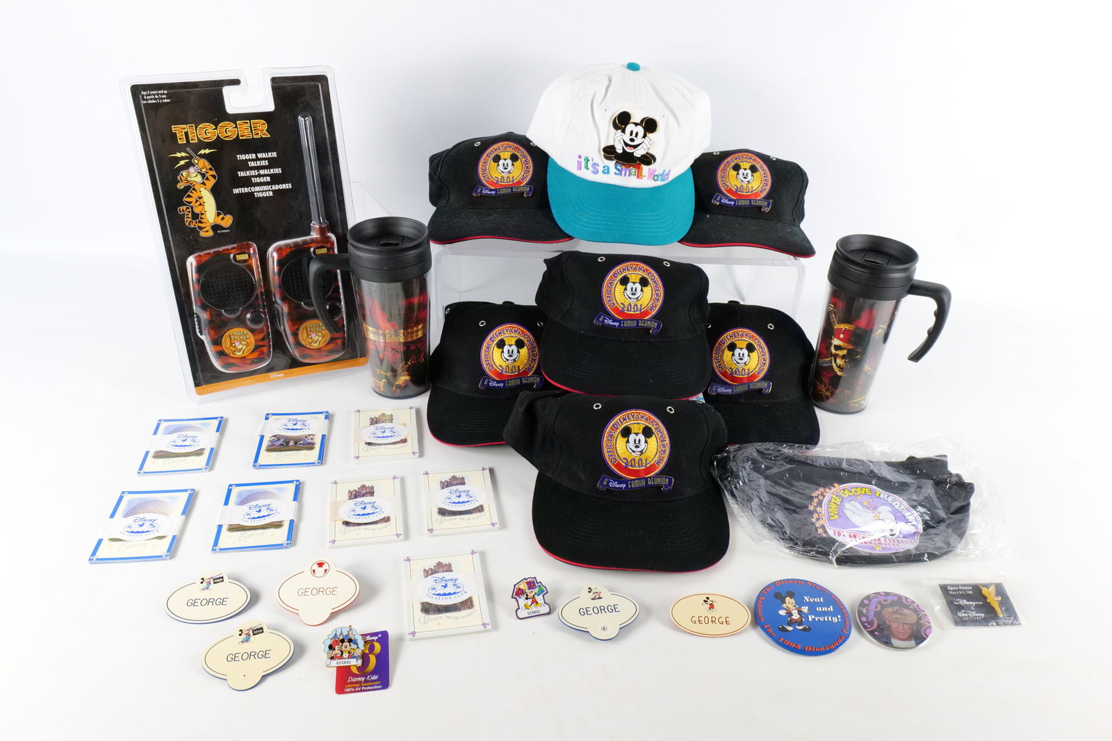 Lot of Disney Collectibles: Lot of Disney Collectibles. Including Tigger Walkie Talkie, Pirates of the Caribbean Travel Mugs, American Express Card Member Fanny Pack, and Various Convention Hats with their pins. All invoices mus
