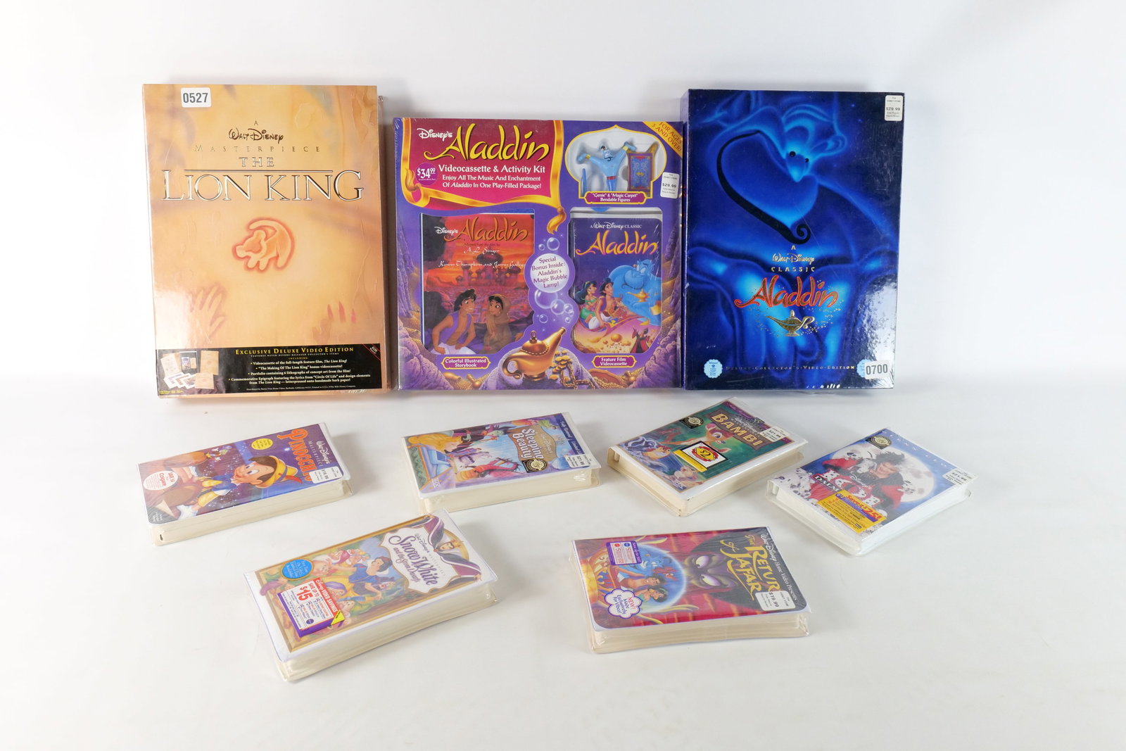 Lot of Sealed Disney VHS: Lot of Sealed Disney VHS. Including Aladdin Videocassette and Activity Kit, Masterpiece The Lion King Deluxe Set, Walt Disney Classic Aladdin Deluxe Box Set, Pinocchio, 101 Dalmatians, The Return of J