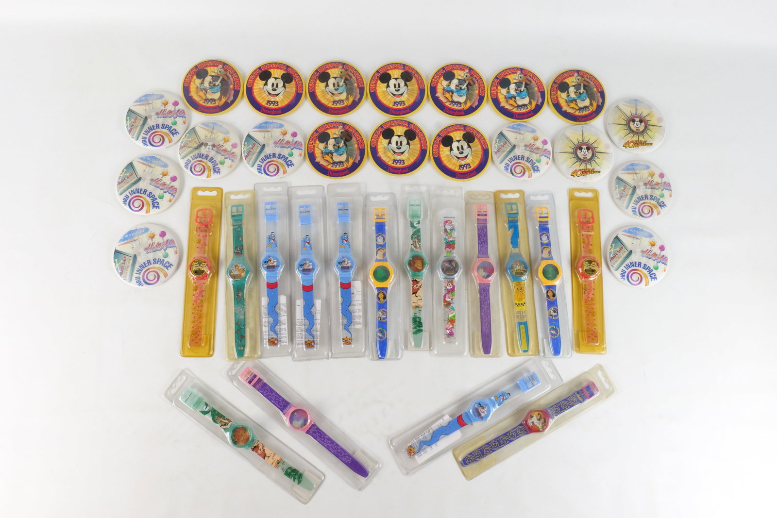 Lot of Disney Children's Watches and Pinback Buttons: Lot of Disney Children's Watches and Pinback Buttons. Watches include Aladdin, Bambi, Snow White, Sleeping Beauty and More. Pinback Buttons come from various Disney Events such as Conventions. All inv
