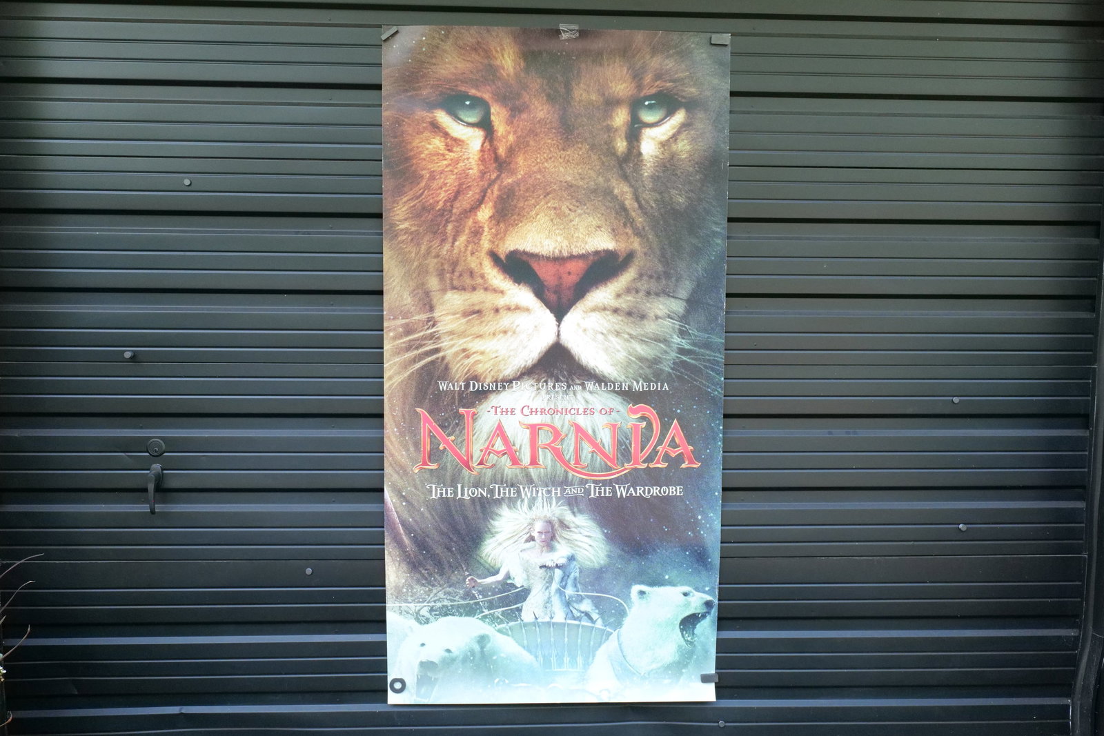 The Chronicles of Narnia Original Vinyl Movie Poster - Oversized: Disney The Chronicles of Narnia - The Lion, The Witch and The Wardrobe Original Vinyl Movie Poster. Some wear to the edges and some tape along the edge. Measures approx. 73" long x 36" wide. All invoi