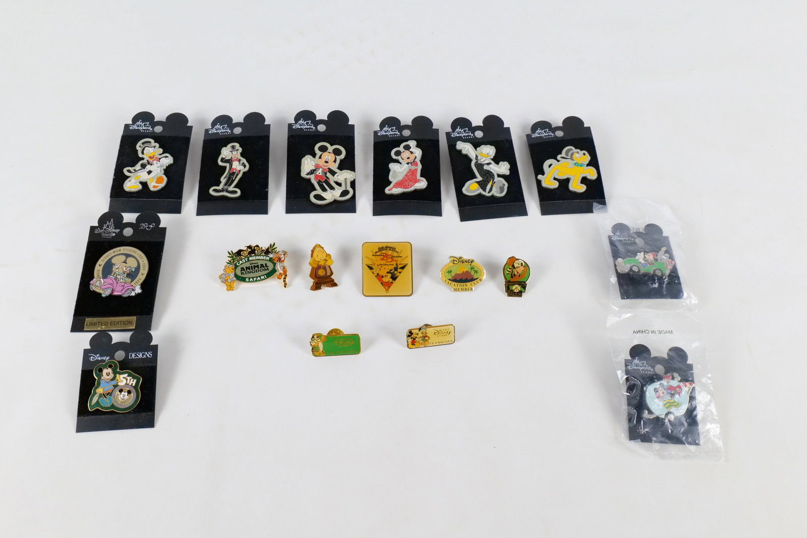 Lot of 17 Disney Pins: Lot of 17 Disney Pins. Including Mickey and Friends Glitter Gala, Limited Edition MGM Studios Pin, Mickey in Car, Disney Store Guest Courtesy Pin, Cast Member Animal Kingdom, DVC Member, Cogsworth and