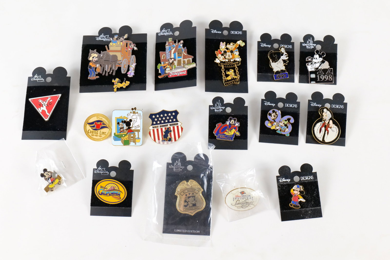 Lot of 17 Disney Pins: Lot of 17 Disney Pins. Including Stagecoach 2 Pin Set, Goofy Toontown House, DCA, Mickey and Walt, Various Conventions, DCL, Cruella, and more. Many pins come on card back or are sealed in package. Al