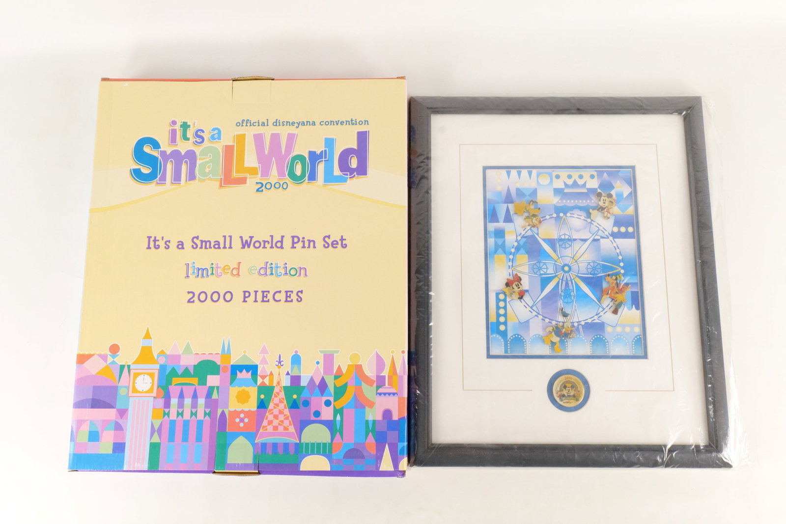 Disneyana Convention It's a Small World Framed Pin Set: Official Disneyana Convention It's a Small World Limited Edition Framed Pin Set. Limited to 2000 pieces. Comes with original box. Measures 18 1/2 inches tall by 15 inches wide. All invoices must be pa
