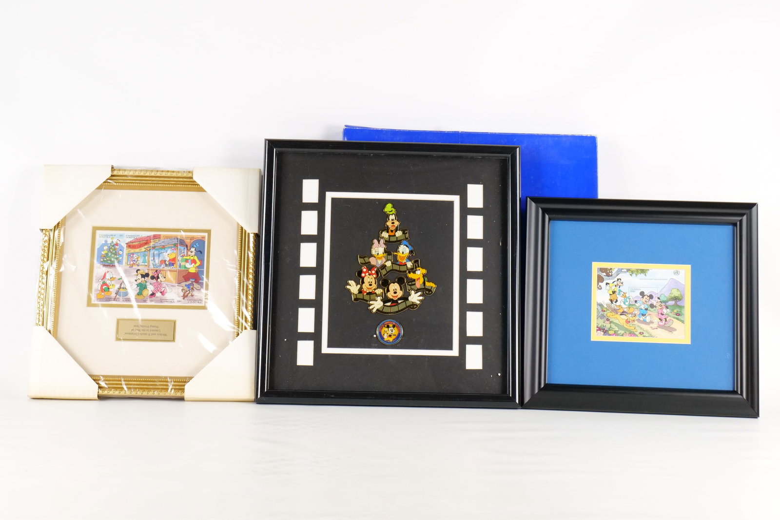Lot of Disney Stamp Sets and Framed Pin Set: Lot of Disney Stamp Sets and Framed Pin Set. Including Mickey and Friends 1998 Convention Pin Set with Movie Scrolls, Fab 5 Jogging Stamp from Uganda, and Mickey and Friends Christmas - Dominica Stamp