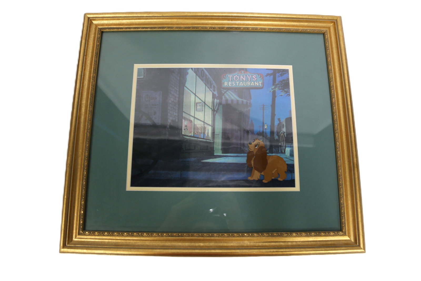 Disney Original Production Cel - Lady and the Tramp: Disney Original Production Cel - Lady and the Tramp. Depicting Lady looking at Tony's restaurant. Unsigned and no COA. Believed to be pre-Disney mark era. Framed and matted. Measures 18.25 inches tall
