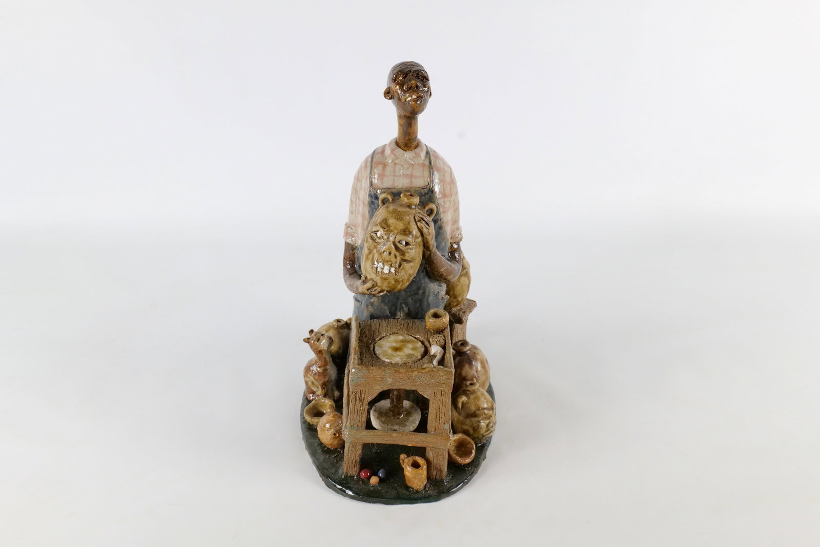 Vintage Ed Berdej Hand Sculpted Folk Art Pottery Figurine: Vintage Ed Berdej Hand Sculpted Folk Art Pottery Figurine - Potter at work with monster jug and accents. This piece is an eccentric, highly detailed hand-sculpted ceramic art piece featuring a Potter 