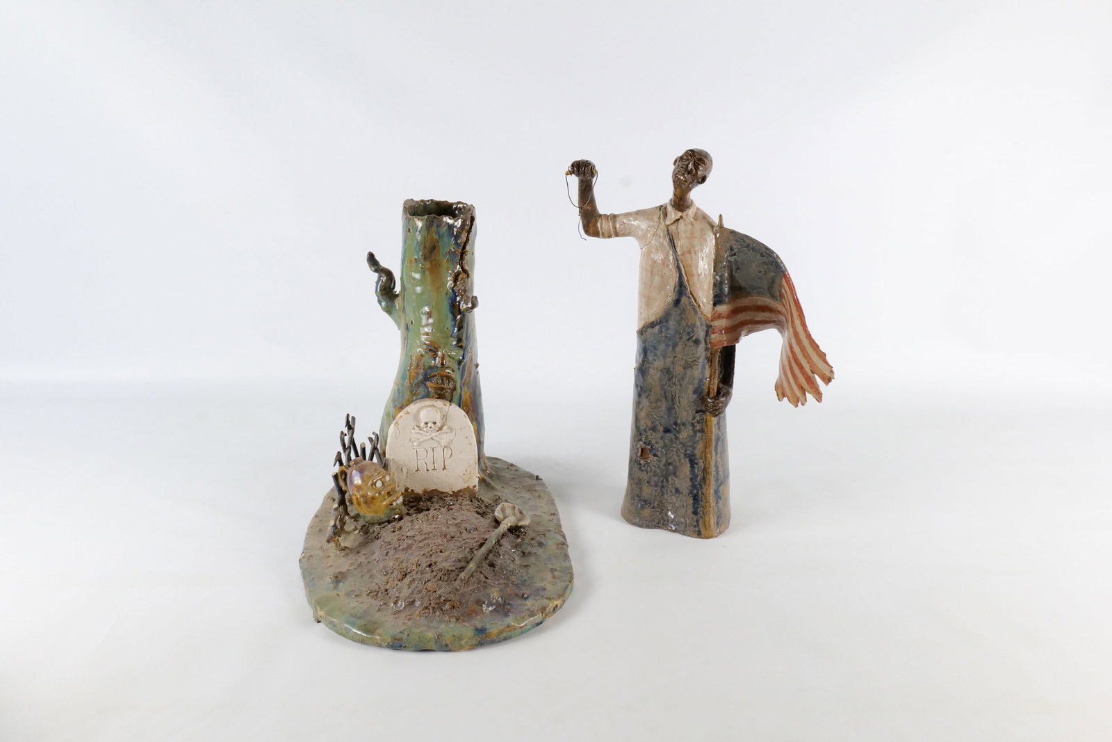 Vintage Folk Art Pottery Sculpture Set: Vintage Folk Art Pottery Sculpture Set by Ed Berdej - Patriotic Farmer figure and Graveyard Face Tree Diorama. The diorama depicts a RIP gravestone, figural face vessel, face hollow tree , and shovel 
