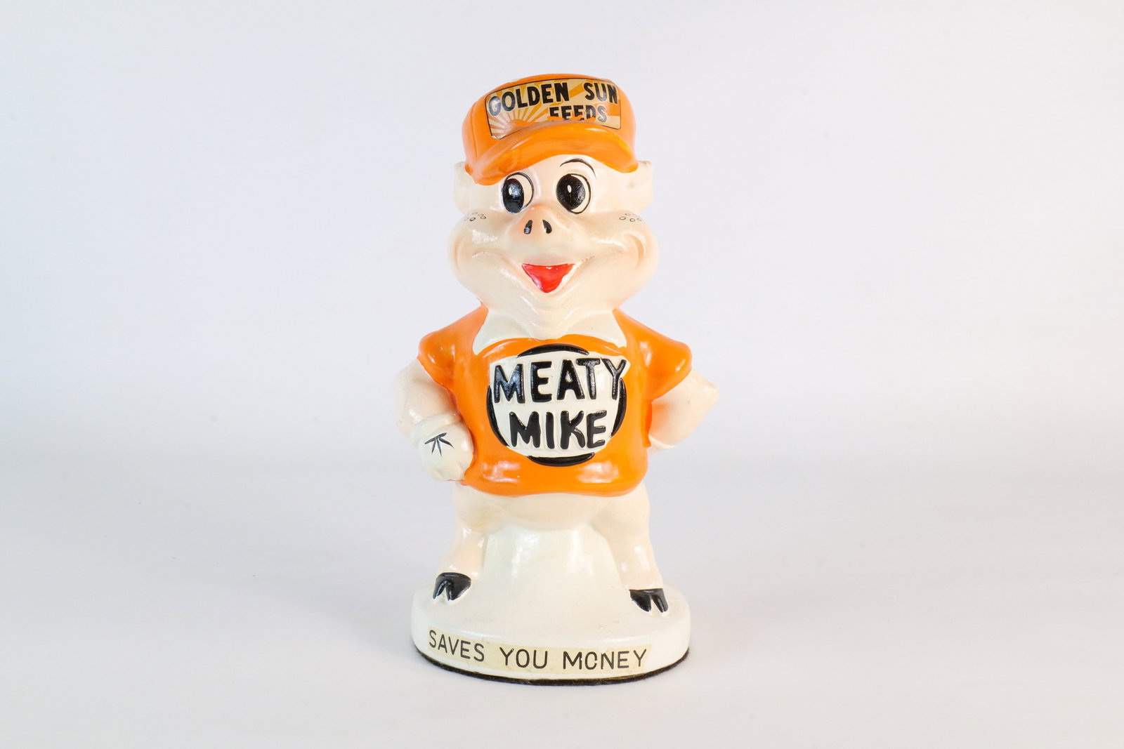 Vintage Golden Sun Feeds Meaty Mike Promotional Advertising Piggy Bank: Vintage 1960s Golden Sun Feeds Meaty Mike Promotional Advertising Piggy Bank. Decals intact. Vibrant bright coloring. Overall very good condition for age. Measures 8.25 inches tall by 4.5 inches wide.