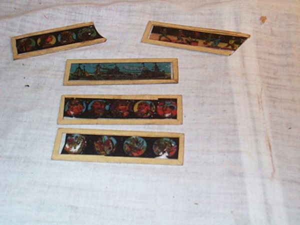 Lot of 3 Glass Slides, plus 2 broken slides inc.: Lot of 3 Glass Slides, plus 2 broken slides inc. boats, children and travel, measure 4" long, 1 1/8" wide. Buyer to pay $20.00 shipping and handling, all items to be sent USPS Priority Mail with Deliv