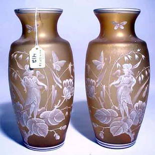 PAIR OF MARY GREGORY DESIGN ENAMEL DECORATED GLASS: PAIR OF MARY GREGORY DESIGN ENAMEL DECORATED GLASS VASES, each of baluster form, the decorations depicting a young woman amid flowers and butterflies; 10-1/2 inch height