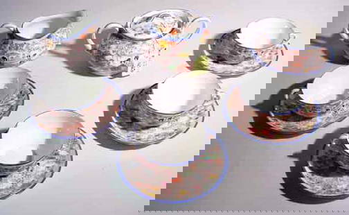 TEN PIECE FLORAL DECORATED TEA SET: TEN PIECE FLORAL DECORATED TEA SET, the decorations depicting figures in a landscape, includes four cups and saucers, covered creamer and sugar