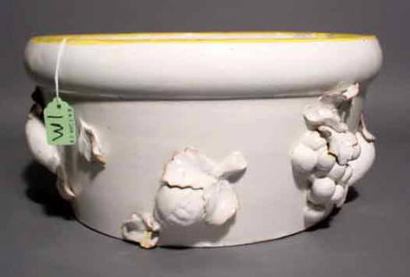 ITALIAN GLAZED CERAMIC CIRCULAR JARDINIERE, havi: ITALIAN GLAZED CERAMIC CIRCULAR JARDINIERE, having applied floral decorations; 13 inch diameter; 7 inch height (chips) NOTE: Sold for the benefit of the Museum of Fine Arts, Houston