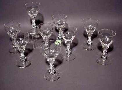 SET OF EIGHT FLUTED CRYSTAL WINE STEMS, having f: SET OF EIGHT FLUTED CRYSTAL WINE STEMS, having faceted stems; 6 inch height NOTE: Sold for the benefit of the Museum of Fine Arts, Houston (chip to one base)