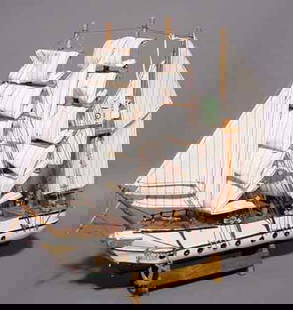 HAND CRAFTED SCALE MODEL OF A THREE-MASTED FRIGA: HAND CRAFTED SCALE MODEL OF A THREE-MASTED FRIGATE, fully rigged, set on a display stand; 16 inch length; 14 inch height