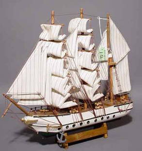 HAND CRAFTED SCALE MODEL OF A THREE-MASTED FRIGA: HAND CRAFTED SCALE MODEL OF A THREE-MASTED FRIGATE, fully rigged, set on a display stand; 16 inch length; 14 inch height