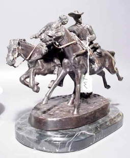 AFTER FREDERIC REMINGTON, ''Wounded Bunkie'', pa: AFTER FREDERIC REMINGTON, ''Wounded Bunkie'', patinated bronze figural group of two riders; on a black marble base; 9 inch height