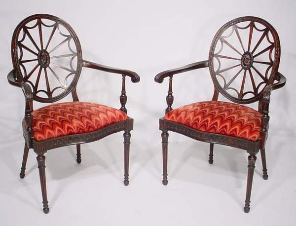SUPERB PAIR OF GEORGE III STYLE WEB-BACK DESIGN M: SUPERB PAIR OF GEORGE III STYLE WEB-BACK DESIGN MAHOGANY ARMCHAIRS, early 20th century, with pierced oval beaded concave backs issuing serpentine acanthus carved arms above a vitruvian scroll carved s