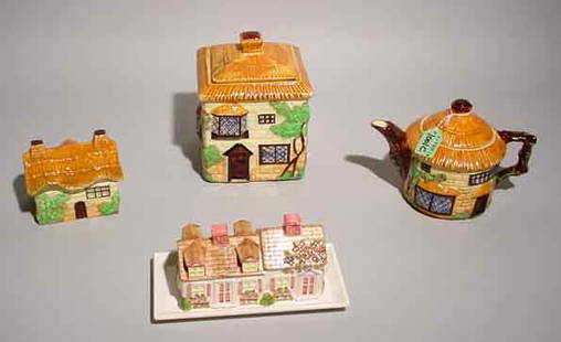 LOT OF FOUR ENGLISH DECORATED CERAMIC COTTAGE FI: LOT OF FOUR ENGLISH DECORATED CERAMIC COTTAGE FIGURED TABLE ITEMS, marked Beswick, England, includes teapot, covered biscuit jar, small cottage figured covered box and a cottage figured covered 