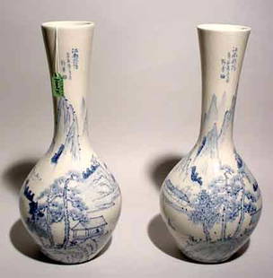 PAIR OF CHINESE BLUE AND WHITE DECORATED PORCELA: PAIR OF CHINESE BLUE AND WHITE DECORATED PORCELAIN VASES, having a bottle form, the continuous decorations depicting villages along the Ling River; 16 inch height (Est. 30-50 the Pair)