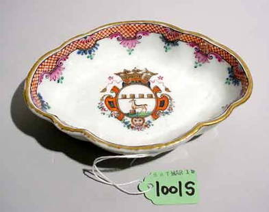 CHINESE EXPORT DISH, circa 1740-1760: OVAL SCALLOPED CHINESE EXPORT DISH, circa 1740-1760, produced for the Dutch market, decorated with a coat of arms; 6-1/4 inch length PROVENANCE: Eleanor Gordon