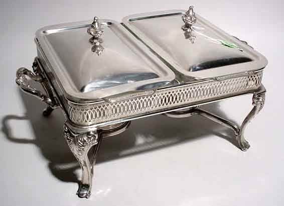 SILVERPLATED DOUBLE CHAFING DISH, having two Pyr: SILVERPLATED DOUBLE CHAFING DISH, having two Pyrex liners with silverplated covers, the double burner stand supported on cabriole legs ending in scrolling feet; 15-1/2 inch length; 11 inch width; 9 in