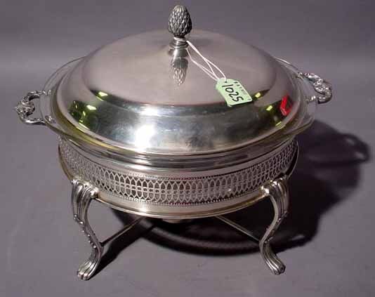 CIRCULAR SILVERPLATED COVERED ENTREE DISH WITH PY: CIRCULAR SILVERPLATED COVERED ENTREE DISH WITH PYREX LINER AND BURNER STAND, supported on cabriole legs; 14 inch diameter (Est. 70-100)