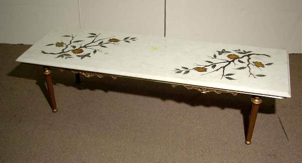DEC LOUIS XVI STYLE BRASS-MARBLE TOP COFFEE TABLE: DECORATIVE LOUIS XVI STYLE POLISHED BRASS MARBLE TOP COFFEE TABLE, circa 1940, having an incised and hand-painted top decoration of flowering branches, raised on straight reeded legs; 60 inch length;