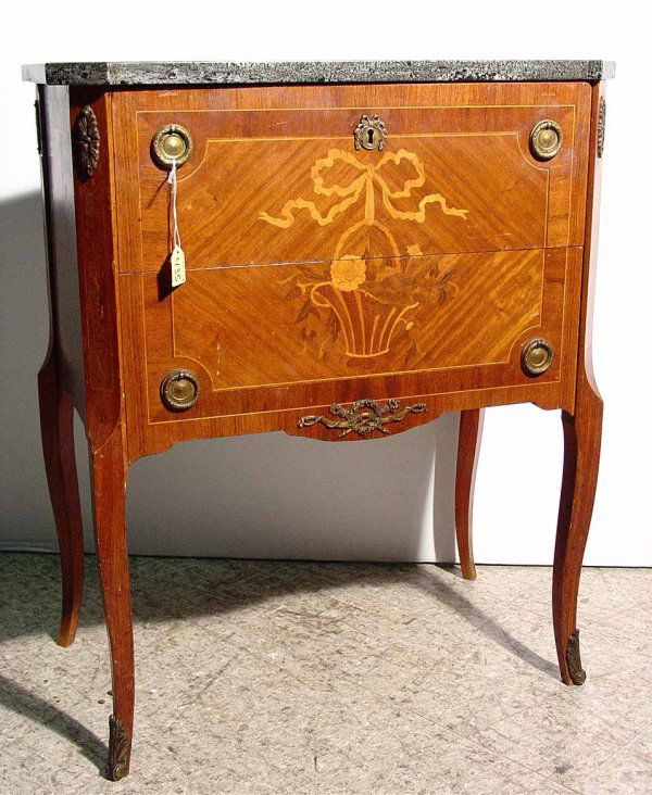 LOUIS XV/XVI TRANSITIONAL STYLE MARQUETRY INLAID R: LOUIS XV/XVI TRANSITIONAL STYLE MARQUETRY INLAID ROSEWOOD AND MAHOGANY TWO-DRAWER MARBLE TOP COMMODE, circa 1900-1920, having canted corners, the floral marquetry front design depicting a basket of fl
