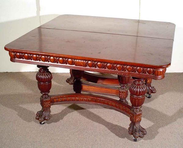 GOOD VICTORIAN CARVED MAHOGANY RECTANGULAR EXTENDI: GOOD VICTORIAN CARVED MAHOGANY RECTANGULAR EXTENDING DINING TABLE, circa 1870, having rounded corners, with boldly carved egg-and-dart design apron, supported by turned and bulbous carved legs, the en