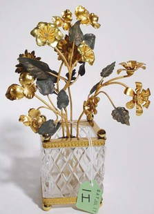 SMALL GILT METAL FLORAL ARRANGEMENT IN SQUARE CUT: SMALL GILT METAL FLORAL ARRANGMENT IN SQUARE CUT CRYSTAL GILT METAL MOUNTED JARDINIERE; 9 inch height (Est. 30-50) PROVENANCE: Jenny Asby Webb, Houston, Texas